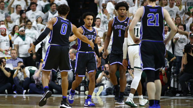 EAST LANSING, MICHIGAN - DECEMBER 03: Tre Jones #3 of the Duke Blue Devils celebrates a first half basket with teammates while playing the Michigan State Spartans at Breslin Center on December 03, 2019 in East Lansing, Michigan.