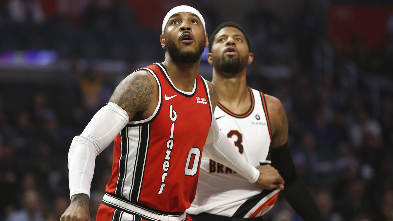 LOS ANGELES, CALIFORNIA - DECEMBER 03: Carmelo Anthony #00 of the Portland Trail Blazers guards Paul George #13 of the Los Angeles Clippers during the first half at Staples Center on December 03, 2019 in Los Angeles, California.
