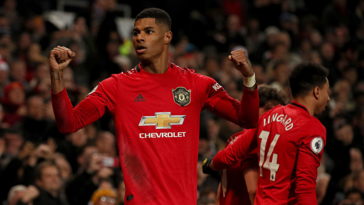 MANCHESTER, ENGLAND - DECEMBER 04: Marcus Rashford of Manchester United celebrates after scoring a goal to make it 2-1 during the Premier League match between Manchester United and Tottenham Hotspur at Old Trafford on December 4, 2019 in Manchester, United Kingdom.