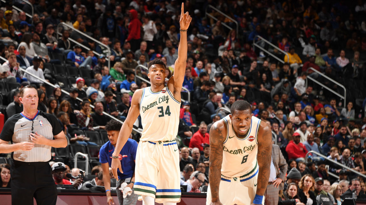 DETROIT, MI - DECEMBER 4: Eric Bledsoe #6 of the Milwaukee Bucks and Giannis Antetokounmpo #34 of the Milwaukee Bucks look on during the game against the Detroit Pistons on December 4, 2019 at Little Caesars Arena in Detroit, Michigan. NOTE TO USER: User expressly acknowledges and agrees that, by downloading and/or using this photograph, User is consenting to the terms and conditions of the Getty Images License Agreement. Mandatory Copyright Notice: Copyright 2019 NBAE