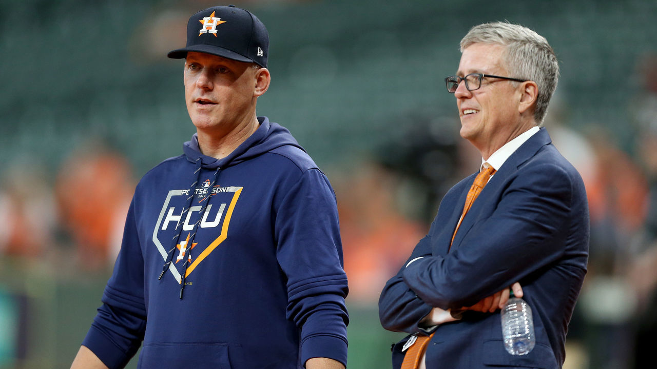 HOUSTON, TEXAS - OCTOBER 05: Manager AJ Hinch #14 talks with Jeff Luhnow, General Manager of the Houston Astros, prior to game two of the American League Division Series against the Tampa Bay Rays at Minute Maid Park on October 05, 2019 in Houston, Texas.