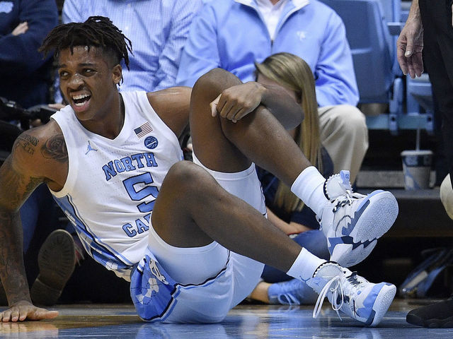 CHAPEL HILL, NORTH CAROLINA - DECEMBER 04: Armando Bacot #5 of the North Carolina Tar Heels reacts after being injured during the first half of their game against the Ohio State Buckeyesat the Dean Smith Center on December 04, 2019 in Chapel Hill, North Carolina.