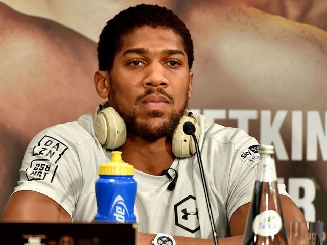 British heavyweight boxing challenger Anthony Joshua is pictured during a press conference in Diriyah in the Saudi capital Riyadh, on December 4, 2019, ahead of the upcoming "Clash on the Dunes". - The hotly-anticipated rematch between Ruiz Jr and British challenger Anthony Joshua is scheduled to take place in Diriya, near the Saudi capital on December 7.