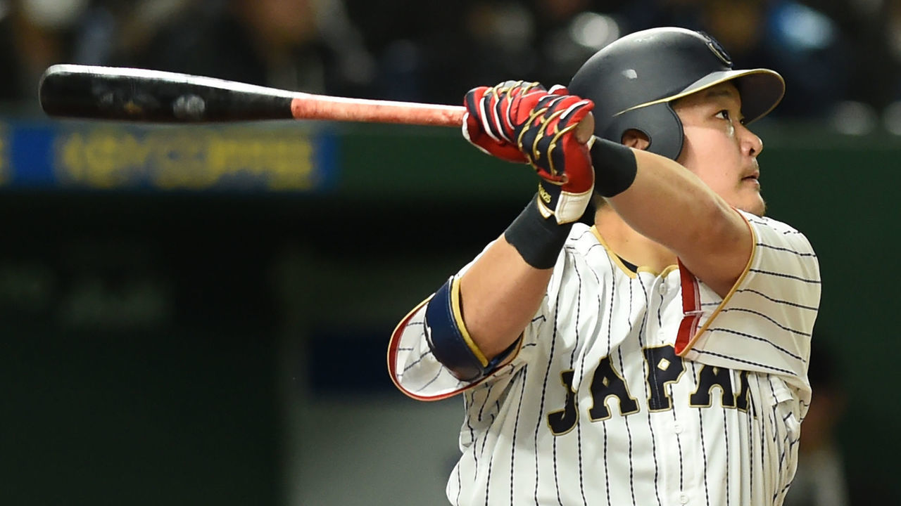Japanese left fielder Yoshitomo Tsutsugo hits a solo homer in the bottom of the sixth inning during the World Baseball Classic Pool E second round match between Israel and Japan at Tokyo Dome in Tokyo on March 15, 2017. / AFP PHOTO / TORU YAMANAKA