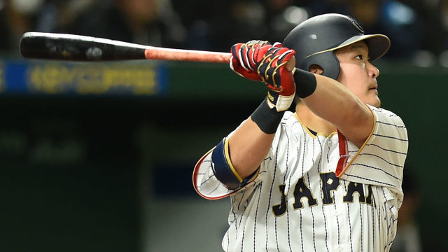 Japanese left fielder Yoshitomo Tsutsugo hits a solo homer in the bottom of the sixth inning during the World Baseball Classic Pool E second round match between Israel and Japan at Tokyo Dome in Tokyo on March 15, 2017. / AFP PHOTO / TORU YAMANAKA