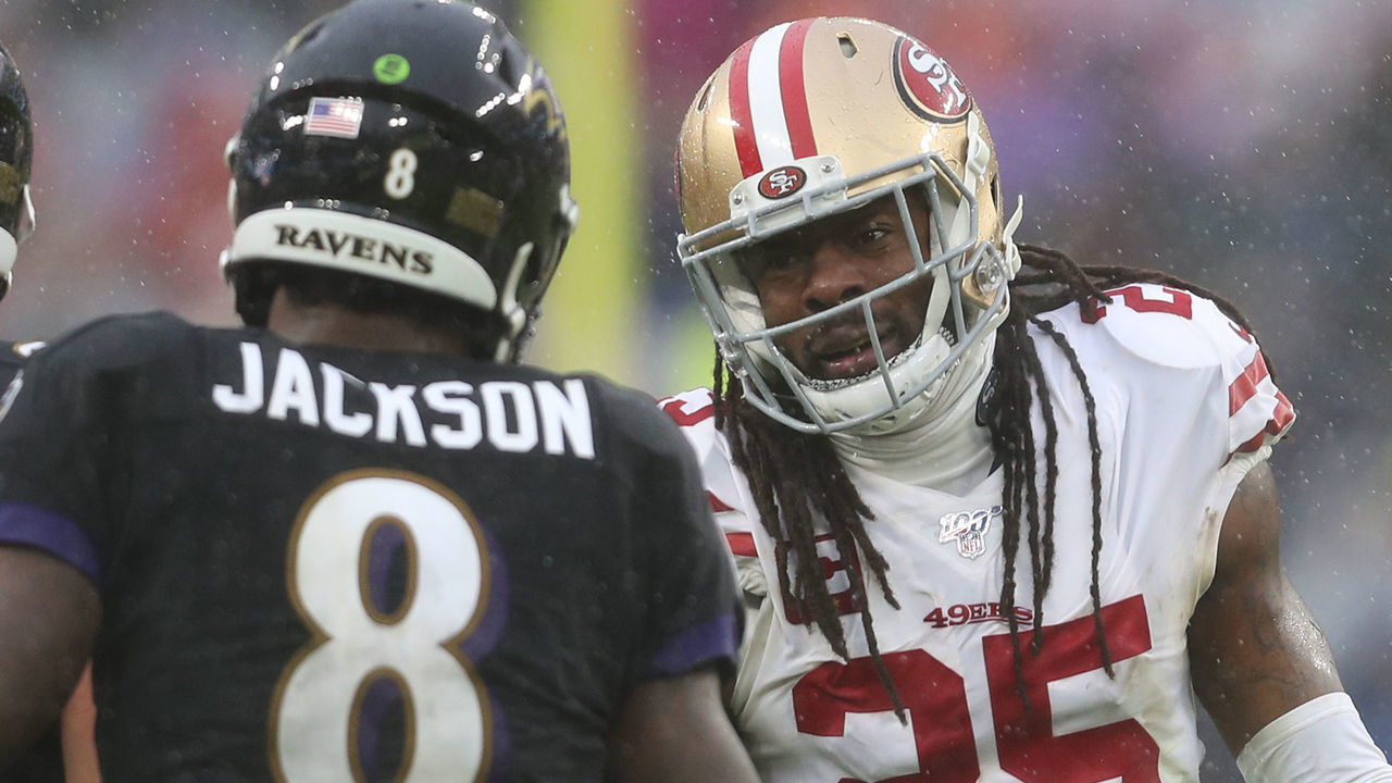 BALTIMORE, MARYLAND - DECEMBER 01: Quarterback Lamar Jackson #8 of the Baltimore Ravens and cornerback Richard Sherman #25 of the San Francisco 49ers talk during the second half at M&T Bank Stadium on December 01, 2019 in Baltimore, Maryland.