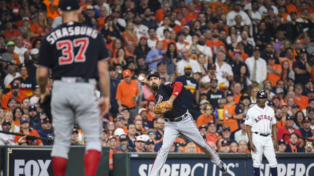 WASHINGTON, DC - OCTOBER 23: Washington Nationals third baseman Anthony Rendon (6) throws a runner out at first base in the fourth inning as Washington Nationals starting pitcher Stephen Strasburg (37) looks on during Game 2 of the World Series between the Washington Nationals and the Houston Astros at Minute Maid Park on Wednesday, October 23, 2019.