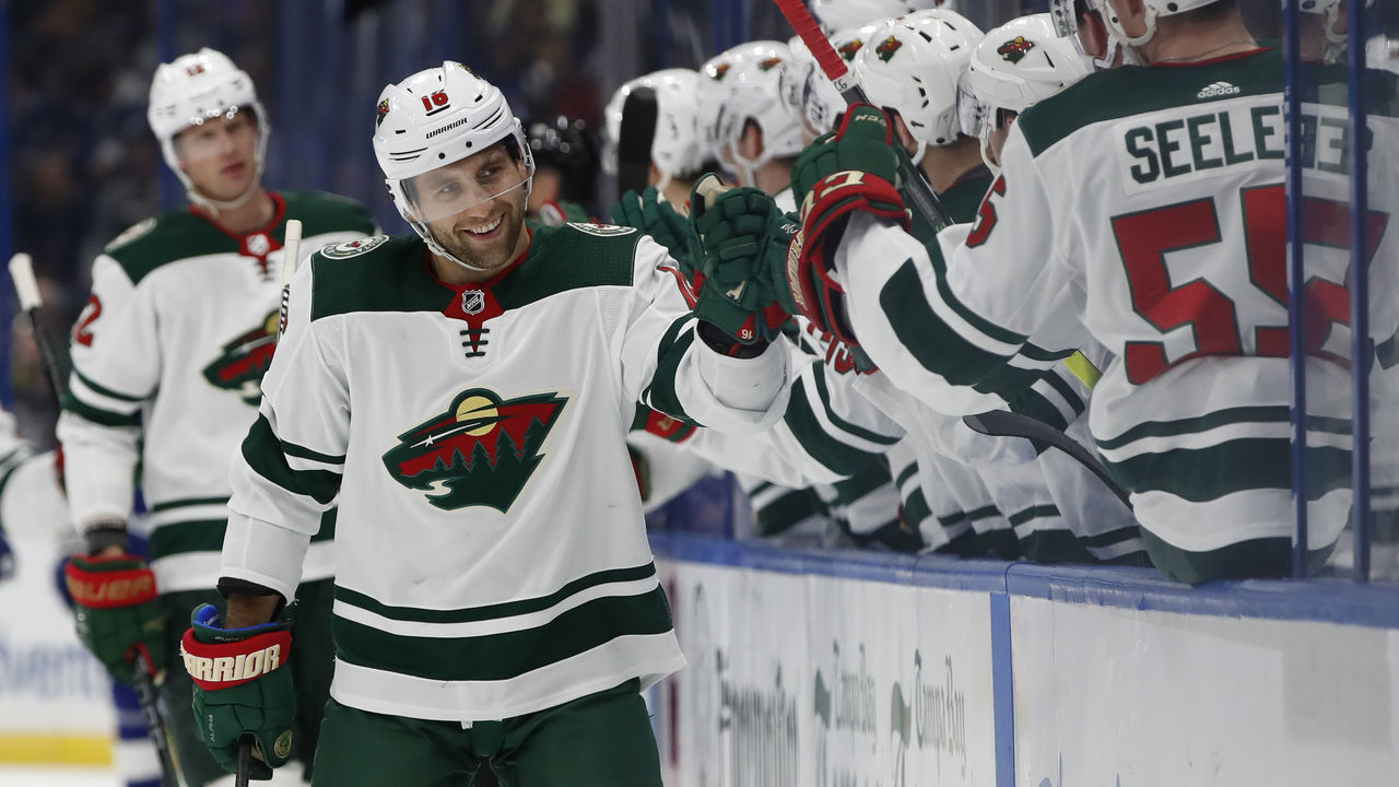 TAMPA, FL - DECEMBER 05: Minnesota Wild left wing Jason Zucker (16) is congratulated by teammates after scoring a goal in the 1st period of the NHL game between the Minnesota Wild and Tampa Bay Lightning on December 05, 2019 at Amalie Arena in Tampa, FL.