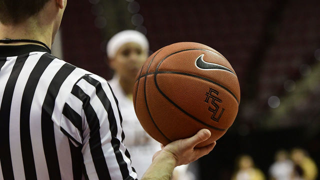 TALLAHASSEE, FL - JANUARY 20: Referee holds the game ball as Kiah Gillespie (15) forward Florida State University (FSU) Seminoles waits to make a free throw against the Duke University Blue Devils during an Atlantic Coast Conference (ACC) match-up, Sunday, January 20, 2019, at Donald Tucker Center in Tallahassee, Florida.