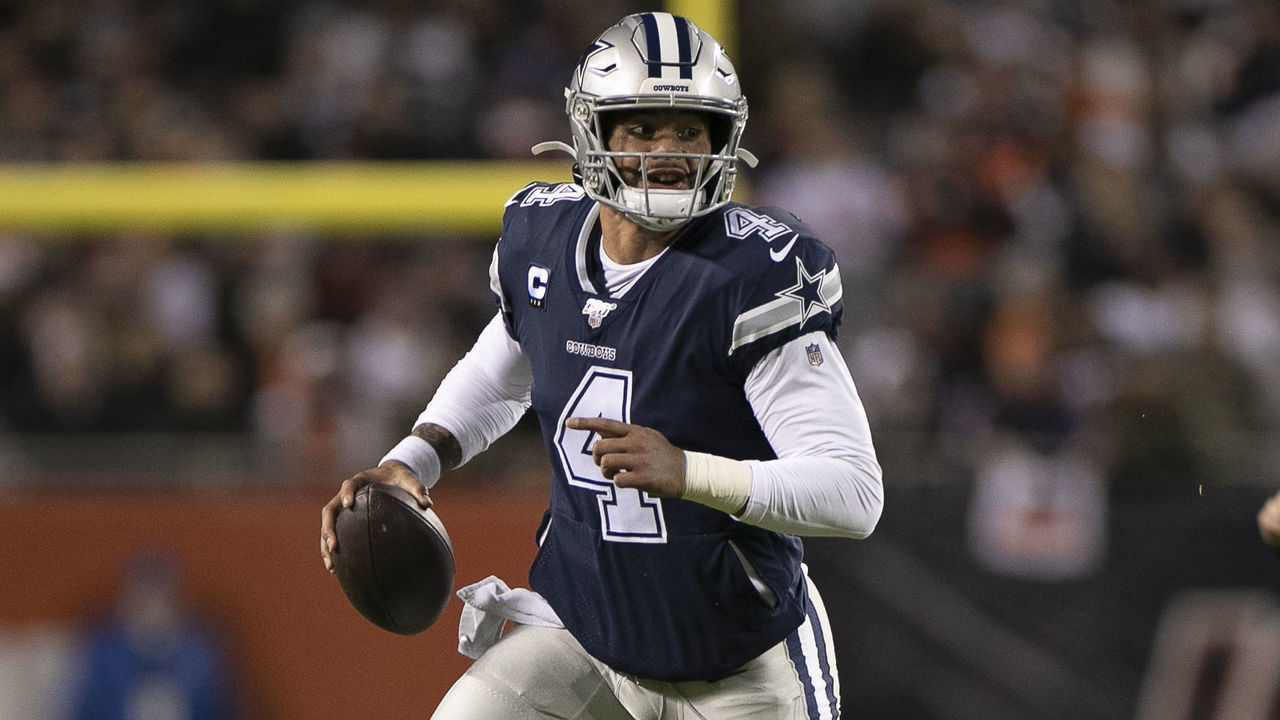 CHICAGO, IL - DECEMBER 05: Dallas Cowboys quarterback Dak Prescott (4) runs with the football in game action during a NFL game between the Chicago Bears and the Dallas Cowboys on December 05, 2019 in Soldier Field in Chicago, IL.