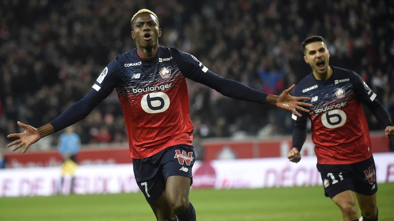 Lille's Nigerian forward Victor Osimhen (L) celebrates after scoring during the French L1 football match between Lille (LOSC) and Brest at the Pierre Mauroy stadium in Villeneuve-d'Ascq, northern France on December 6, 2019.