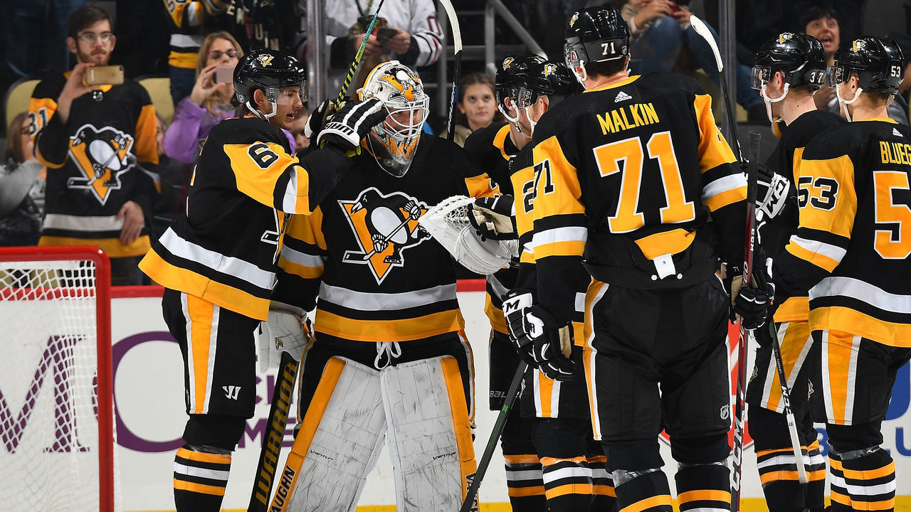 PITTSBURGH, PA - DECEMBER 06: Tristan Jarry #35 of the Pittsburgh Penguins celebrates with teammates after a 2-0 win over the Arizona Coyotes at PPG PAINTS Arena on December 6, 2019 in Pittsburgh, Pennsylvania.