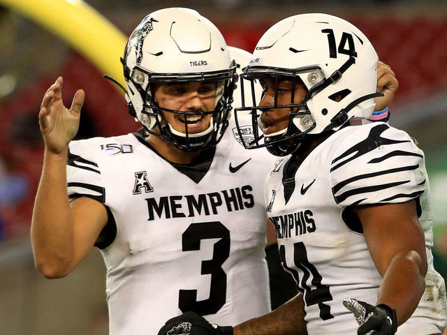 TAMPA, FLORIDA - NOVEMBER 23: Brady White #3 and Antonio Gibson #14 of the Memphis Tigers celebrates a touchdown during a game against the South Florida Bulls at Raymond James Stadium on November 23, 2019 in Tampa, Florida.