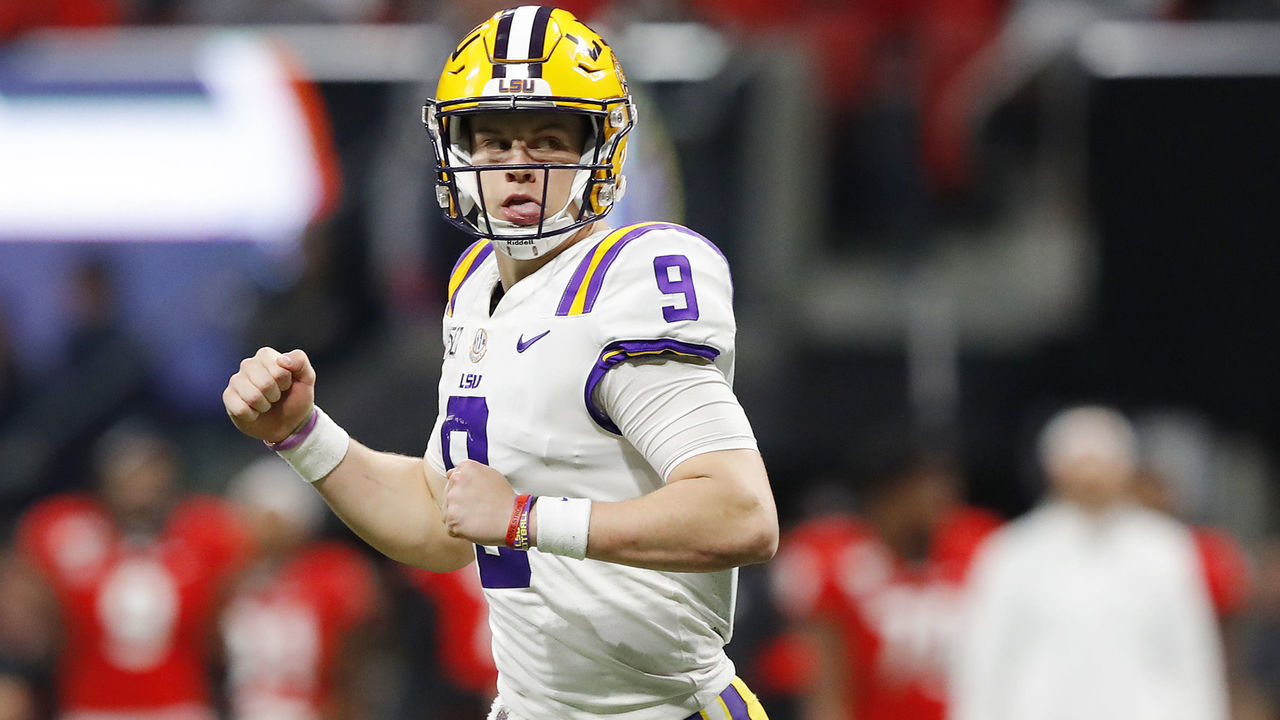 ATLANTA, GEORGIA - DECEMBER 07: Joe Burrow #9 of the LSU Tigers celebrates after throwing a touchdown pass to Terrace Marshall Jr. #6 (not pictured) in the third quarter against the Georgia Bulldogs during the SEC Championship game at Mercedes-Benz Stadium on December 07, 2019 in Atlanta, Georgia.