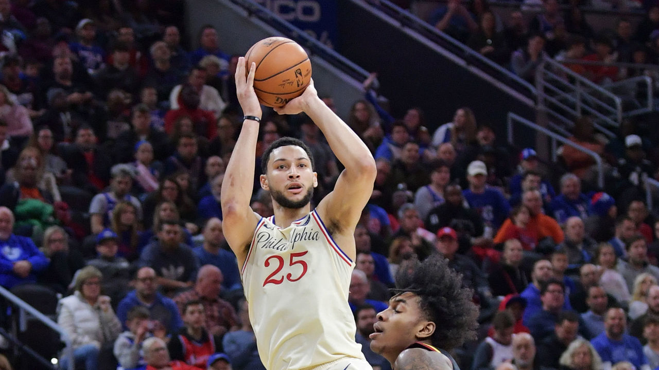 PHILADELPHIA, PA - DECEMBER 07: Ben Simmons #25 of the Philadelphia 76ers takes a shot over Kevin Porter Jr. #4 of the Cleveland Cavaliers in the second half at Wells Fargo Center on December 7, 2019 in Philadelphia, Pennsylvania. The 76ers won 141-94.