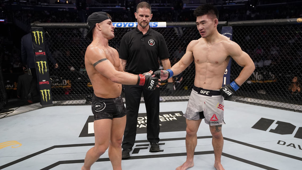 WASHINGTON, DC - DECEMBER 07: (L-R) Cody Stamann and Song Yadong of China react after their bantamweight bout is ruled a majority draw during the UFC Fight Night event at Capital One Arena on December 07, 2019 in Washington, DC.