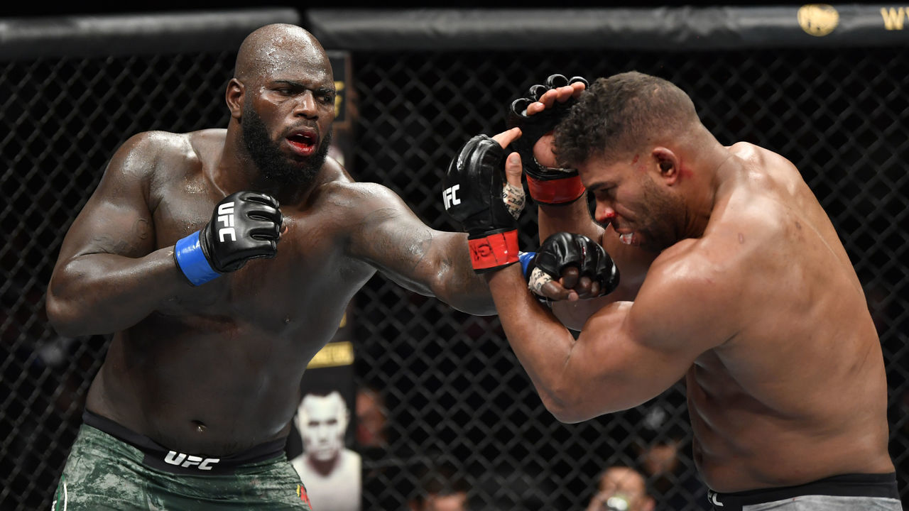 WASHINGTON, DC - DECEMBER 07: (L-R) Jairzinho Rozenstruik of Suriname punches Alistair Overeem of Netherlands in their heavyweight bout during the UFC Fight Night event at Capital One Arena on December 07, 2019 in Washington, DC.