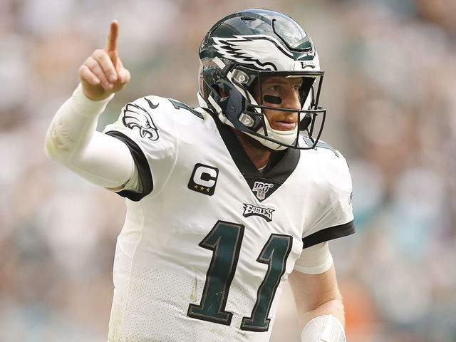MIAMI, FLORIDA - DECEMBER 01: Carson Wentz #11 of the Philadelphia Eagles celebrates after throwing a touchdown to J.J. Arcega-Whiteside #19 (not pictured) against the Miami Dolphins during the second quarter at Hard Rock Stadium on December 01, 2019 in Miami, Florida.