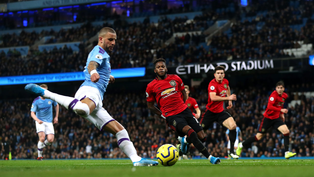 MANCHESTER, ENGLAND - DECEMBER 07: Kyle Walker of Manchester City crosses the ball during the Premier League match between Manchester City and Manchester United at Etihad Stadium on December 07, 2019 in Manchester, United Kingdom.