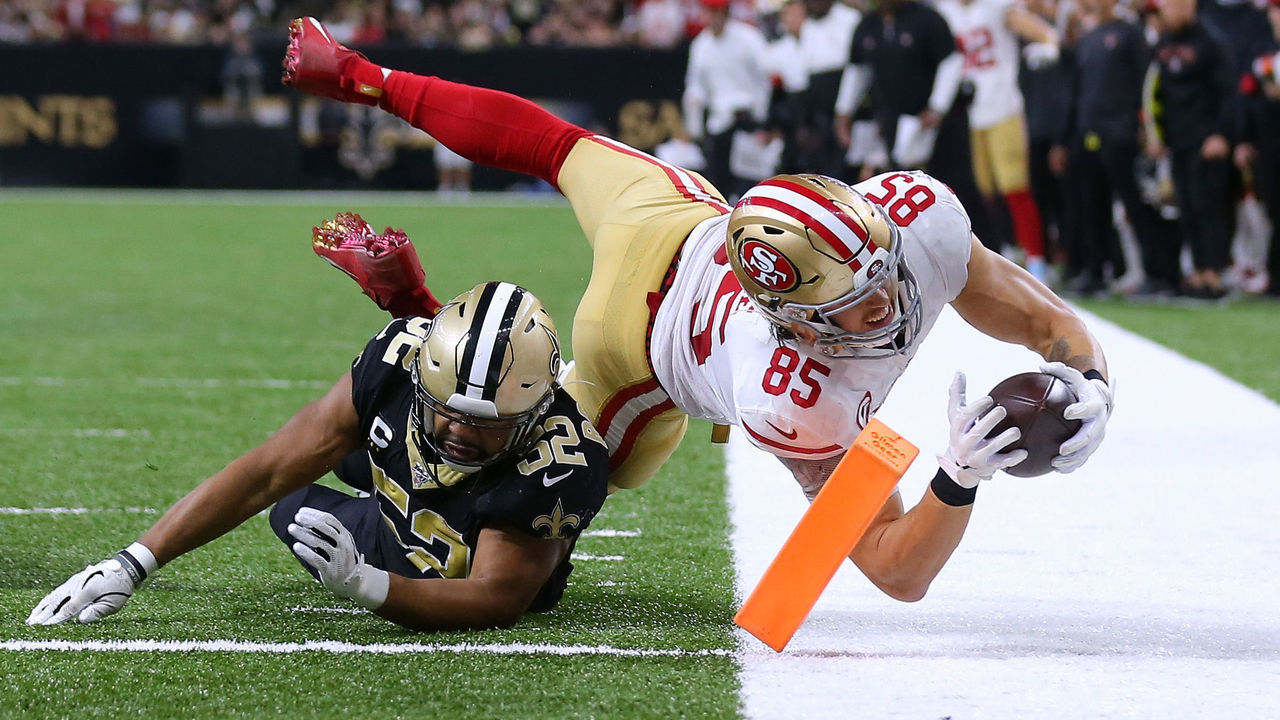 NEW ORLEANS, LOUISIANA - DECEMBER 08: George Kittle #85 of the San Francisco 49ers scores a touchdown as Craig Robertson #52 of the New Orleans Saints defends during the second half of a game at the Mercedes Benz Superdome on December 08, 2019 in New Orleans, Louisiana.