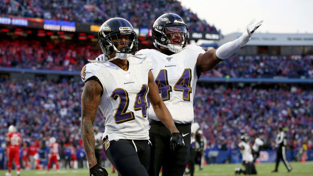 ORCHARD PARK, NEW YORK - DECEMBER 08: Marcus Peters #24 and teammate Marlon Humphrey #44 of the Baltimore Ravens react after breaking up a pass during the fourth quarter of an NFL game against the Buffalo Bills at New Era Field on December 08, 2019 in Orchard Park, New York.