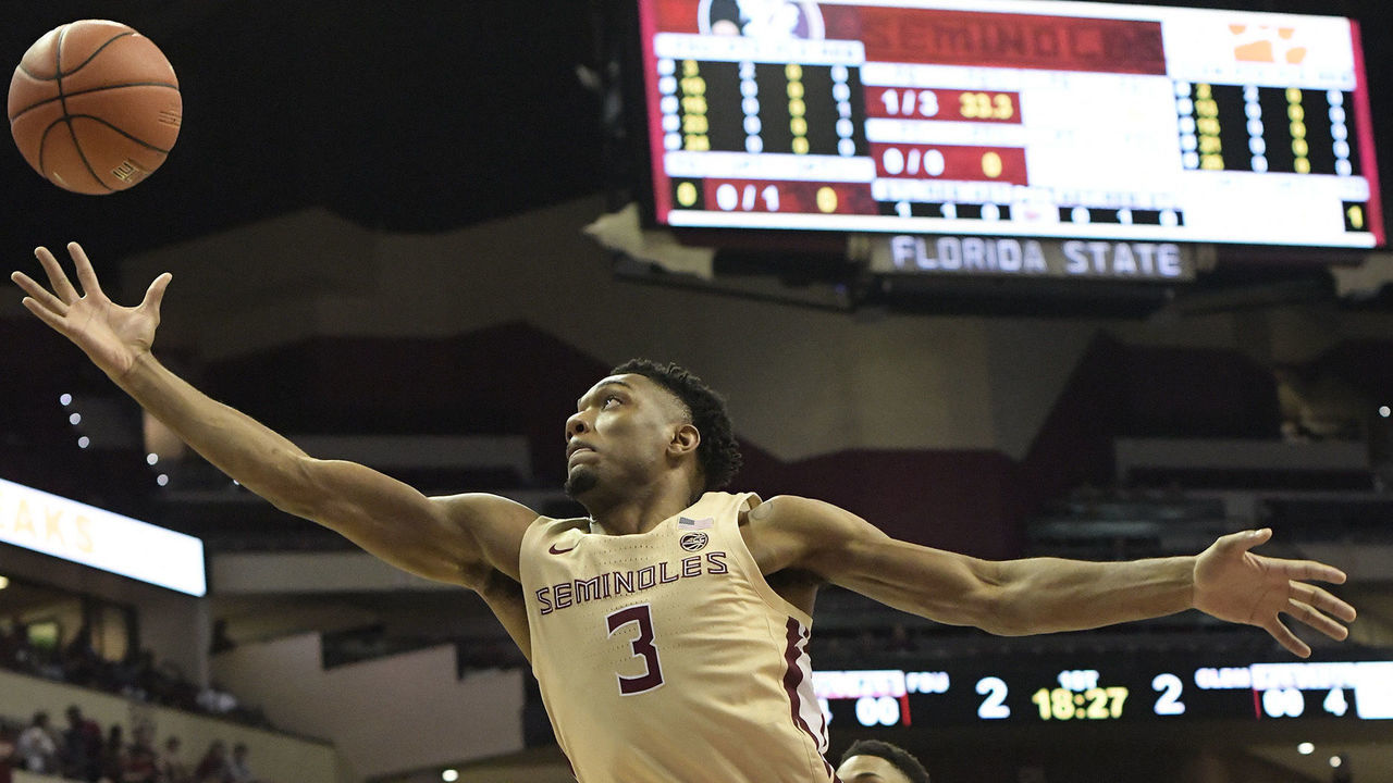 TALLAHASSEE, FL - DECEMBER 08: Trent Forrest (3) guard Florida State University (FSU) Seminoles stretches for a rebound in the game against the Clemson University Tigers in an Atlantic Coast Conference (ACC) basketball game Sunday, December 8, 2019, in the Donald Tucker Civic Center in Tallahassee, Florida.