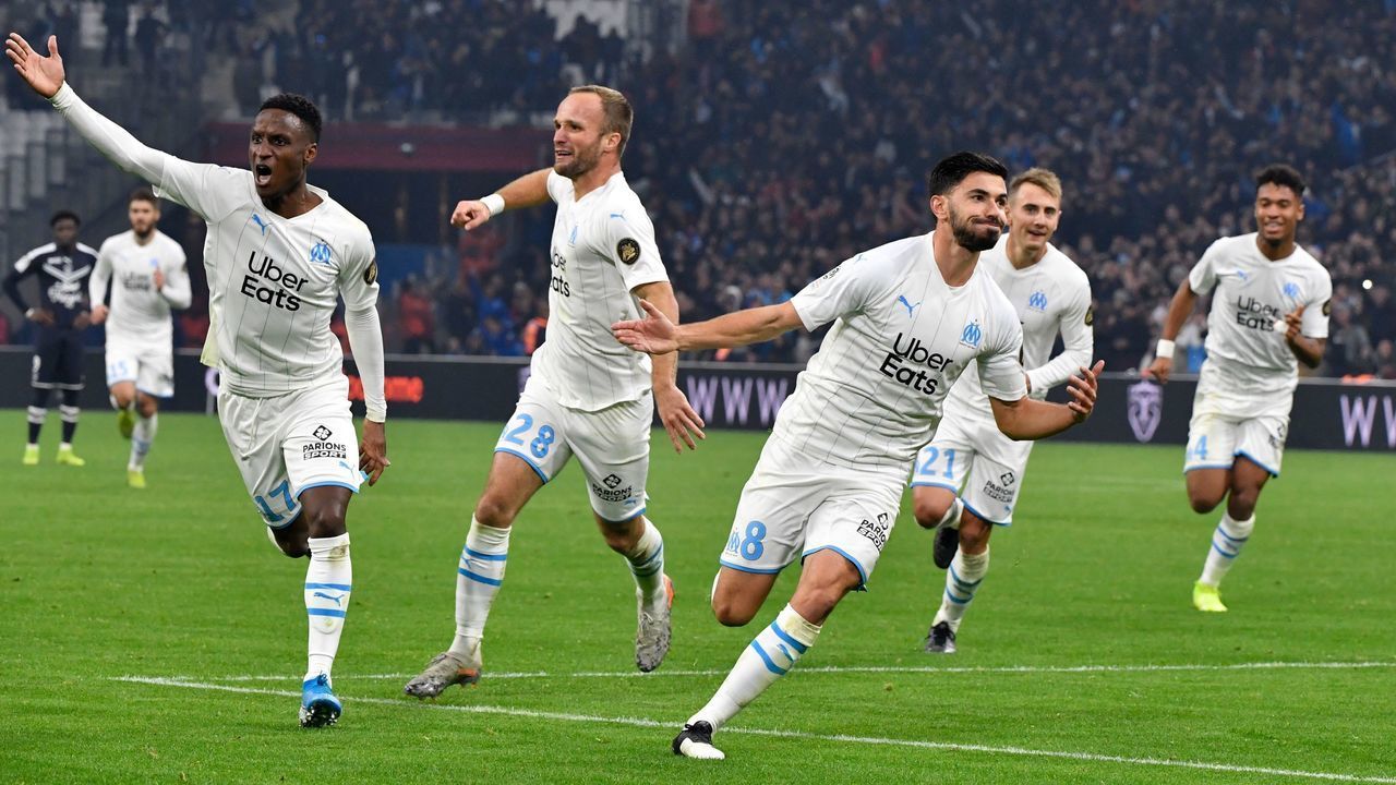 Marseille's French midfielder Morgan Sanson (C) celebrates with teammates after scoring a goal during the French L1 football match between Olympique de Marseille (OM) and FC Girondins de Bordeaux (FCGB) at the Velodrome Stadium in Marseille, southern France, on December 8, 2019.