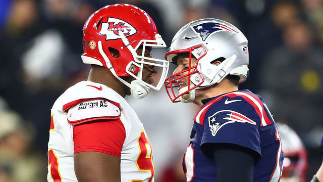 FOXBOROUGH, MASSACHUSETTS - DECEMBER 08: Chris Jones #95 of the Kansas City Chiefs exchanges words with Tom Brady #12 of the New England Patriots during the first half of the game at Gillette Stadium on December 08, 2019 in Foxborough, Massachusetts.