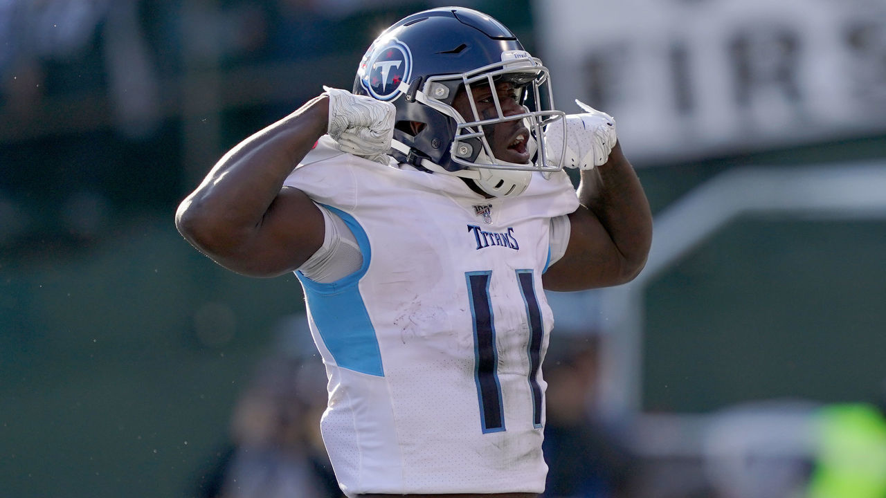 OAKLAND, CALIFORNIA - DECEMBER 08: A.J. Brown #11 of the Tennessee Titans celebrates after he scored a touchdown against the Oakland Raiders during the first half of an NFL football game at RingCentral Coliseum on December 08, 2019 in Oakland, California.