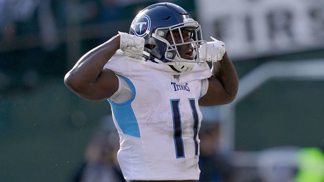 OAKLAND, CALIFORNIA - DECEMBER 08: A.J. Brown #11 of the Tennessee Titans celebrates after he scored a touchdown against the Oakland Raiders during the first half of an NFL football game at RingCentral Coliseum on December 08, 2019 in Oakland, California.