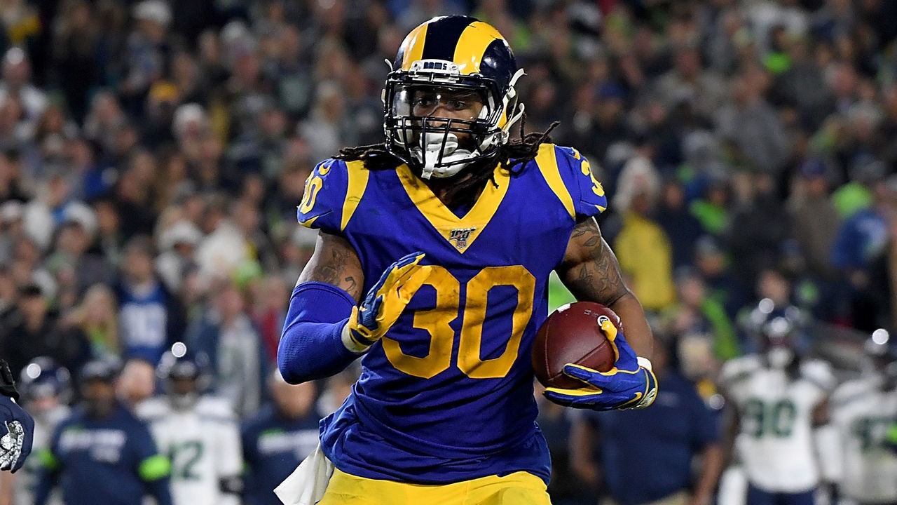 LOS ANGELES, CALIFORNIA - DECEMBER 08: Running back Todd Gurley #30 of the Los Angeles Rams rushes for a touchdown over defensive end Rasheem Green #98 of the Seattle Seahawks in the fourth quarter of the game at Los Angeles Memorial Coliseum on December 08, 2019 in Los Angeles, California.