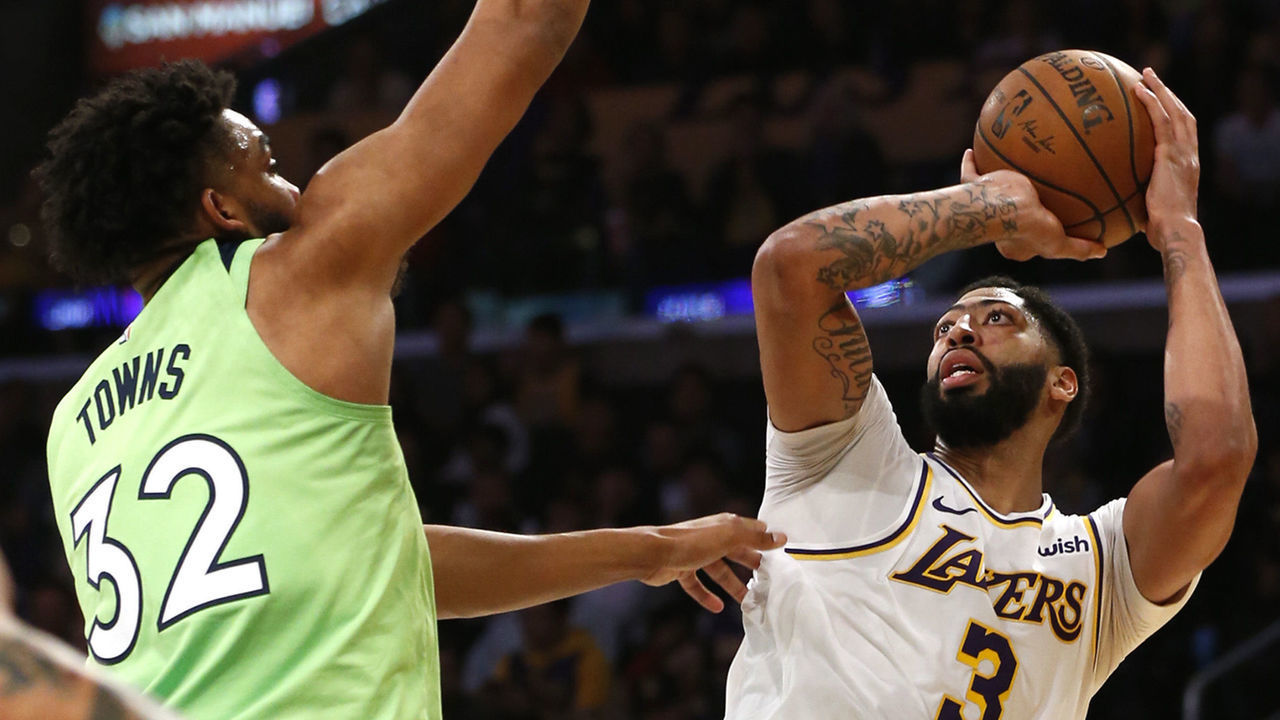 LOS ANGELES, CALIFORNIA - DECEMBER 08: Anthony Davis #3 of the Los Angeles Lakers shoots the ball as Karl-Anthony Towns #32 of the Minnesota Timberwolves defends during the second half at Staples Center on December 08, 2019 in Los Angeles, California.