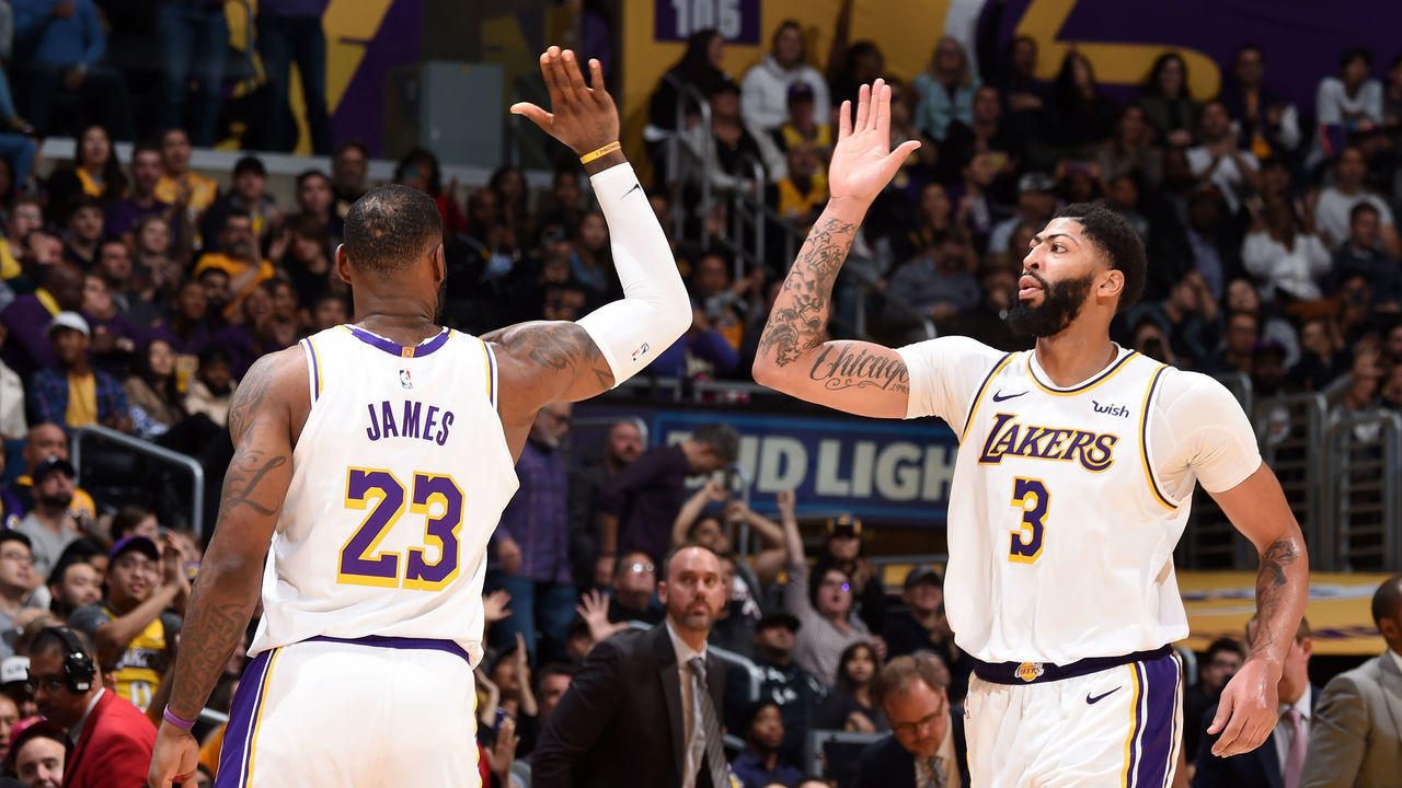 LOS ANGELES, CA - DECEMBER 8: ; LeBron James #23 of the Los Angeles Lakers high fives teammate, Anthony Davis #3 during the game against the Minnesota Timberwolves on December 8, 2019 at STAPLES Center in Los Angeles, California. NOTE TO USER: User expressly acknowledges and agrees that, by downloading and/or using this Photograph, user is consenting to the terms and conditions of the Getty Images License Agreement. Mandatory Copyright Notice: Copyright 2019 NBAE