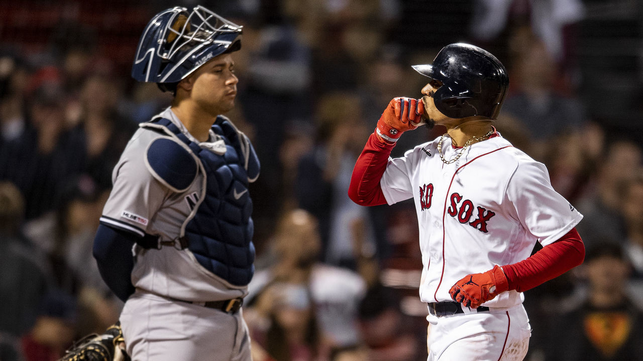 BOSTON, MA - SEPTEMBER 8: Mookie Betts #50 of the Boston Red Sox reacts as Gary Sanchez #24 of the New York Yankees looks on after hitting a solo home run during the eighth inning of a game on September 8, 2019 at Fenway Park in Boston, Massachusetts.