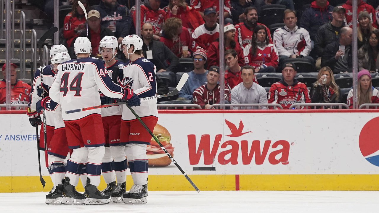 WASHINGTON, DC - DECEMBER 09: Cam Atkinson #13 of the Columbus Blue Jackets celebrates with his teammates after scoring a goal in the first period against the Washington Capitals at Capital One Arena on December 9, 2019 in Washington, DC.