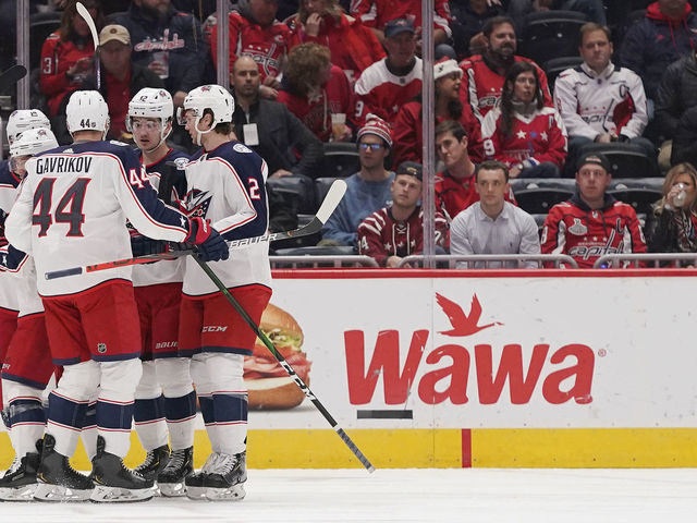WASHINGTON, DC - DECEMBER 09: Cam Atkinson #13 of the Columbus Blue Jackets celebrates with his teammates after scoring a goal in the first period against the Washington Capitals at Capital One Arena on December 9, 2019 in Washington, DC.