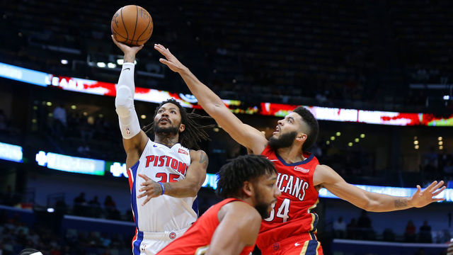 NEW ORLEANS, LOUISIANA - DECEMBER 09: Derrick Rose #25 of the Detroit Pistons shoots against Kenrich Williams #34 of the New Orleans Pelicans during the second half at the Smoothie King Center on December 09, 2019 in New Orleans, Louisiana.