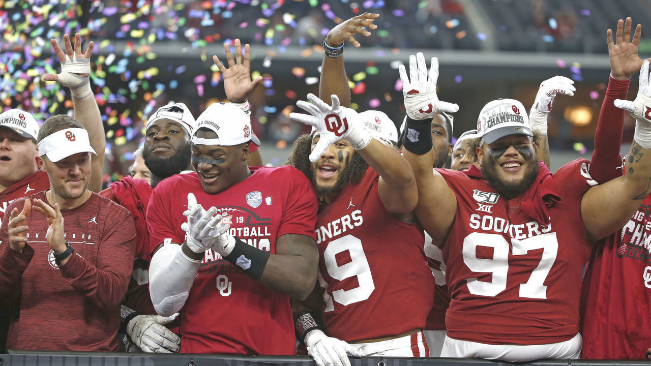 ARLINGTON, TX - DECEMBER 07: Head coach Lincoln Riley of the Oklahoma Sooners celebrates with his team including Caleb Kelly #19 and Marquise Overton #97 after defeating the Baylor Bears 30-23 in the Big 12 Football Championship at AT&T Stadium on December 7, 2019 in Arlington, Texas.