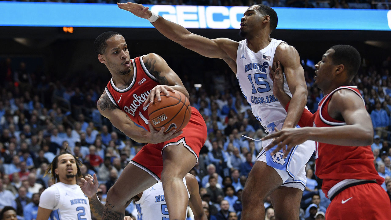 CHAPEL HILL, NORTH CAROLINA - DECEMBER 04: Garrison Brooks #15 of the North Carolina Tar Heels defends a pass from D.J. Carton #3 to Kaleb Wesson #34 of the Ohio State Buckeyes during the first half of their game at the Dean Smith Center on December 04, 2019 in Chapel Hill, North Carolina.