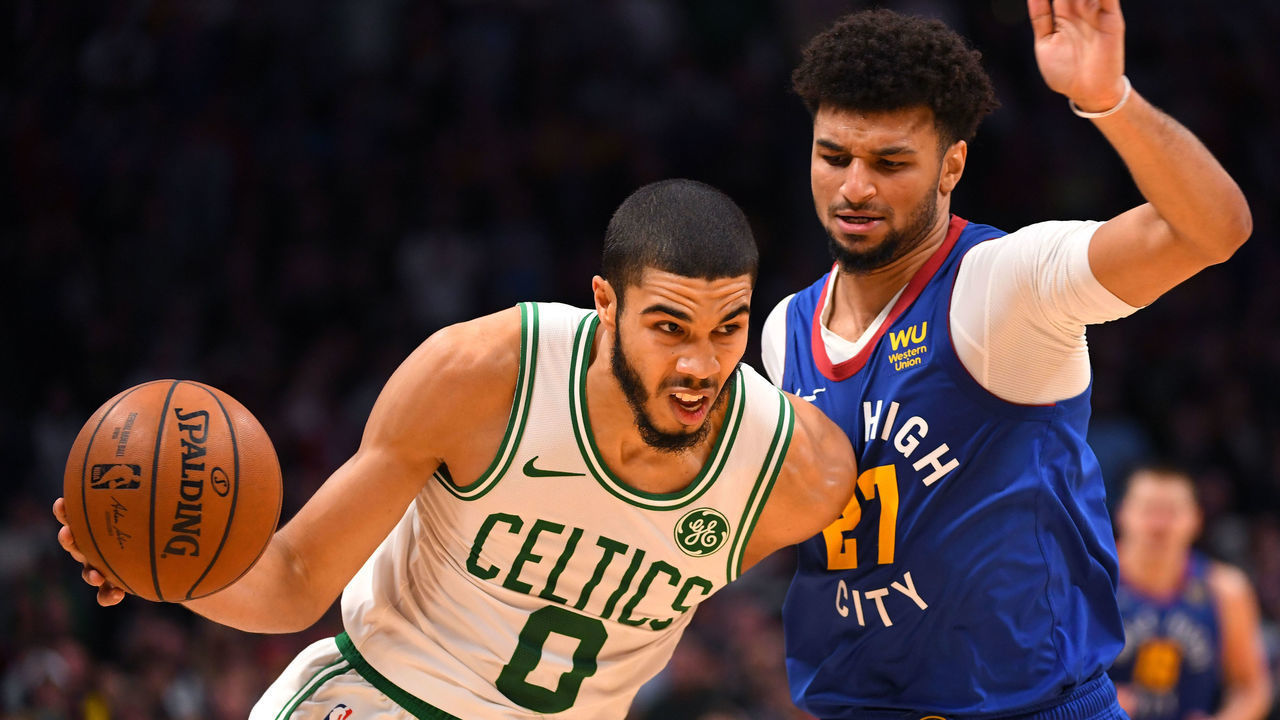 DENVER, CO - NOVEMBER 22: Jayson Tatum #0 of the Boston Celtics drives against Jamal Murray #27 of the Denver Nuggets in the second half at Pepsi Center on November 22, 2019 in Denver, Colorado. NOTE TO USER: User expressly acknowledges and agrees that, by downloading and/or using this photograph, user is consenting to the terms and conditions of the Getty Images License Agreement