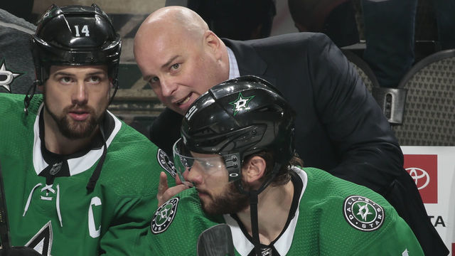 DALLAS, TX - DECEMBER 23: Jim Montgomery, Jamie Benn #14 and Tyler Seguin #91 of the Dallas Stars on the bench against the New York Islanders at the American Airlines Center on December 23, 2018 in Dallas, Texas.
