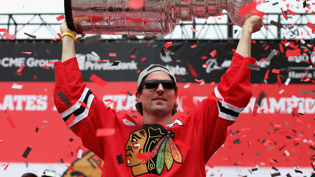 CHICAGO, IL - JUNE 18: Patrick Sharp #10 of the Chicago Blackhawks holds the Stanley Cup trophy during the Chicago Blackhawks Stanley Cup Championship Rally at Soldier Field on June 18, 2015 in Chicago, Illinois.