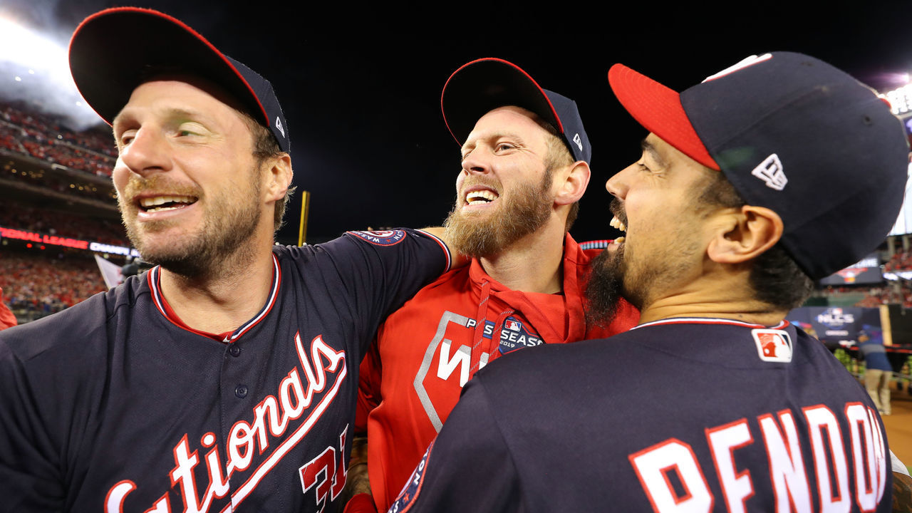 WASHINGTON, DC - OCTOBER 15: Max Scherzer #31 Stephen Strasburg #37 and Anthony Rendon #6 of the Washington Nationals celebrate winning the NL pennant after a 7-4 win in Game 4 of the NLCS against the St. Louis Cardinals at Nationals Park on Tuesday, October 15, 2019 in Washington, District of Columbia.