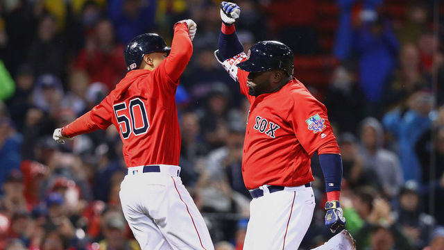 BOSTON, MA - SEPTEMBER 30: David Ortiz #34 of the Boston Red Sox celebrates with Mookie Betts #50 after hitting a two run homer against the Toronto Blue Jays during the seventh inning at Fenway Park on September 30, 2016 in Boston, Massachusetts.