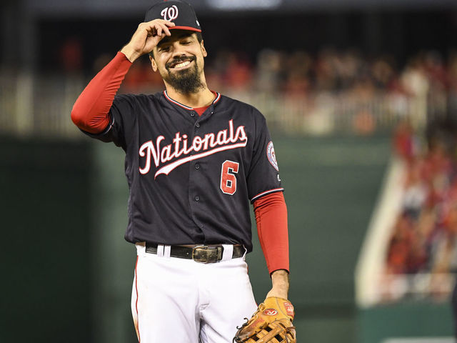 WASHINGTON, DC - OCTOBER 15: Washington Nationals third baseman Anthony Rendon (6) laughs with the St. Louis Cardinals third base coach after a foul ball came in between them in the third inning of Game Four of the NLCS between the Washington Nationals and the St. Louis Cardinals at Nationals Park.