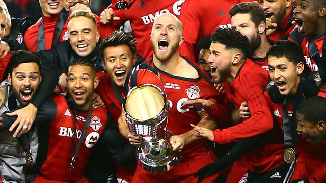 TORONTO, ON - DECEMBER 09: Michael Bradley #4 of Toronto FC lifts the Championship Trophy after winning the 2017 MLS Cup Final against the Seattle Sounders at BMO Field on December 9, 2017 in Toronto, Ontario, Canada.