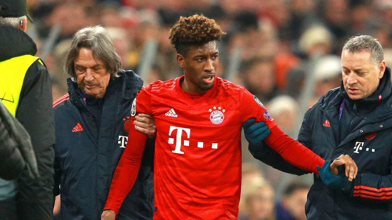 MUNICH, GERMANY - DECEMBER 11: Kingsley Coman of FC Bayern Munich is assisted off the pitch by medical staff after going down with an injury during the UEFA Champions League group B match between Bayern Muenchen and Tottenham Hotspur at Allianz Arena on December 11, 2019 in Munich, Germany.