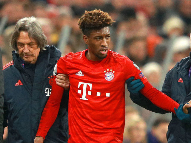 MUNICH, GERMANY - DECEMBER 11: Kingsley Coman of FC Bayern Munich is assisted off the pitch by medical staff after going down with an injury during the UEFA Champions League group B match between Bayern Muenchen and Tottenham Hotspur at Allianz Arena on December 11, 2019 in Munich, Germany.