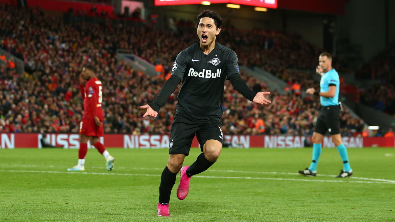 LIVERPOOL, ENGLAND - OCTOBER 02: Takumi Minamino of Red Bull Salzburg celebrates after scoring a goal to make it 3-2 during the UEFA Champions League group E match between Liverpool FC and RB Salzburg at Anfield on October 2, 2019 in Liverpool, United Kingdom.