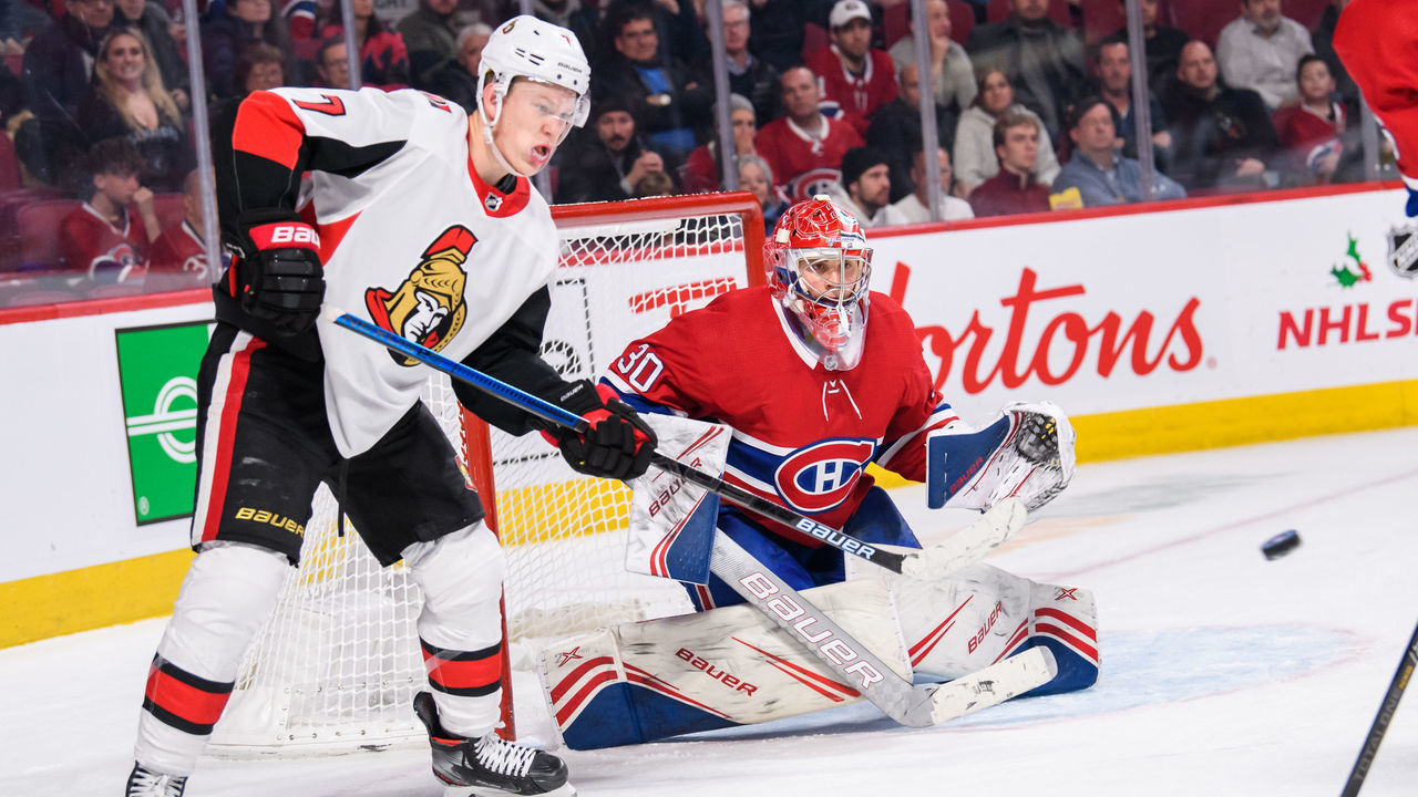 MONTREAL, QC - DECEMBER 11: Brady Tkachuk (7) of the Ottawa Senators tries to deviate the puck by Cayden Primeau (30) of the Montreal Canadiens during the third period of the NHL game between the Ottawa Senators and the Montreal Canadiens on December 11, 2019, at the Bell Centre in Montreal, QC